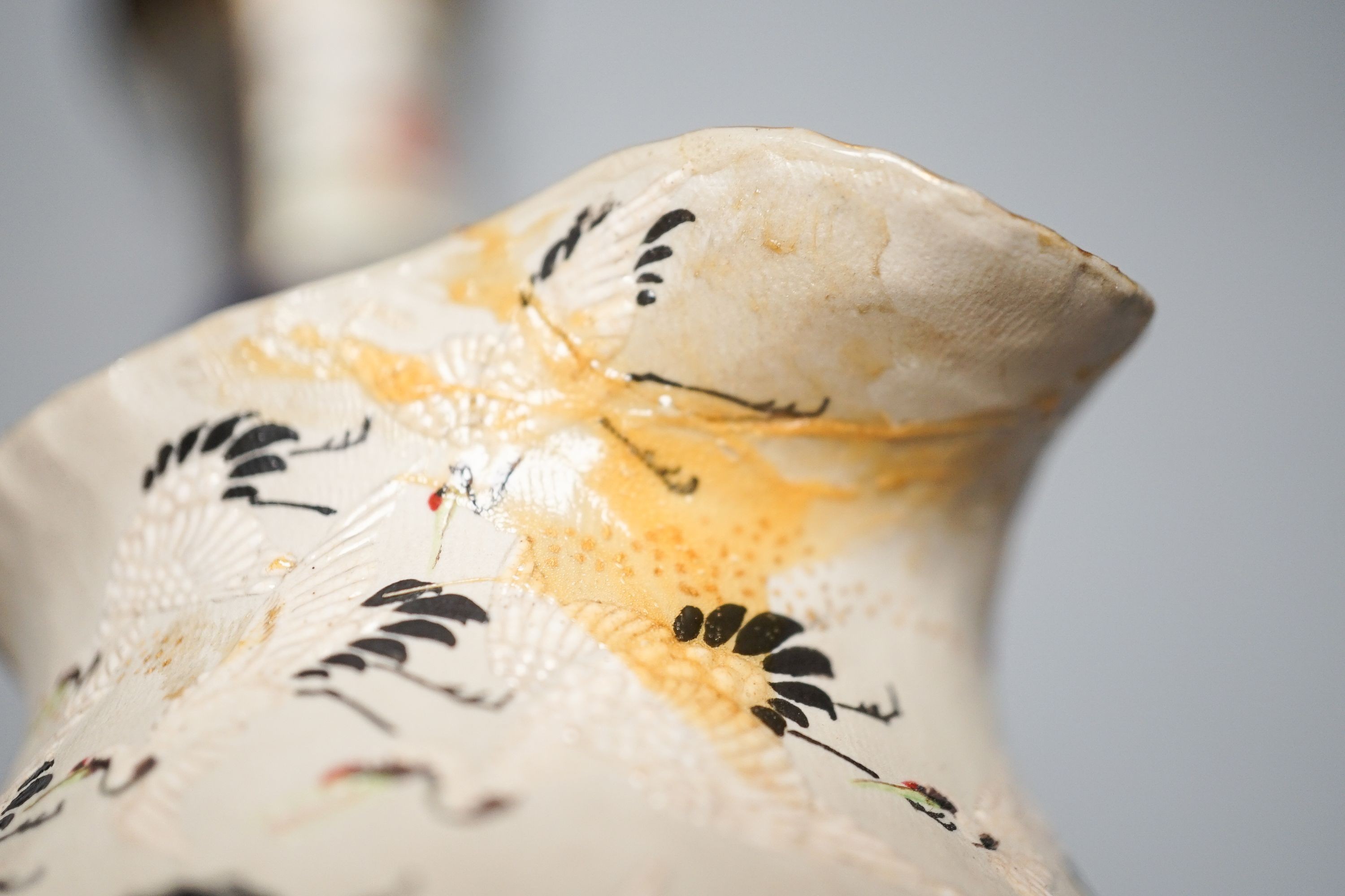 A Japanese black ground ‘cranes’ cloisonné enamel vase, 18.3cm, a Satsuma pottery vase and a crane decorated jug (3)
